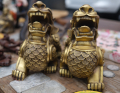 Close-up of two bronze foo dogs